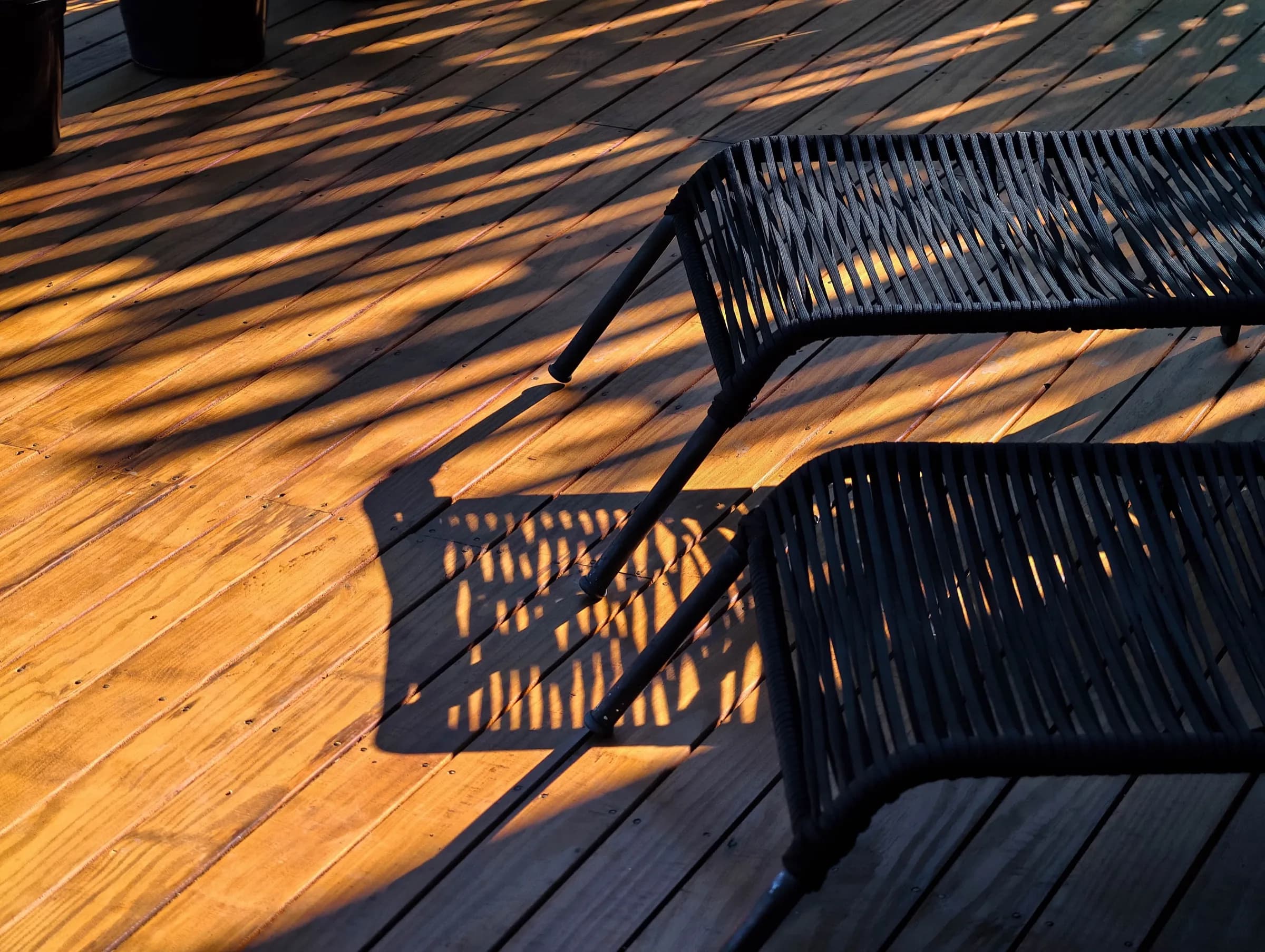 Deck chairs in late afternoon light at Ibirahill