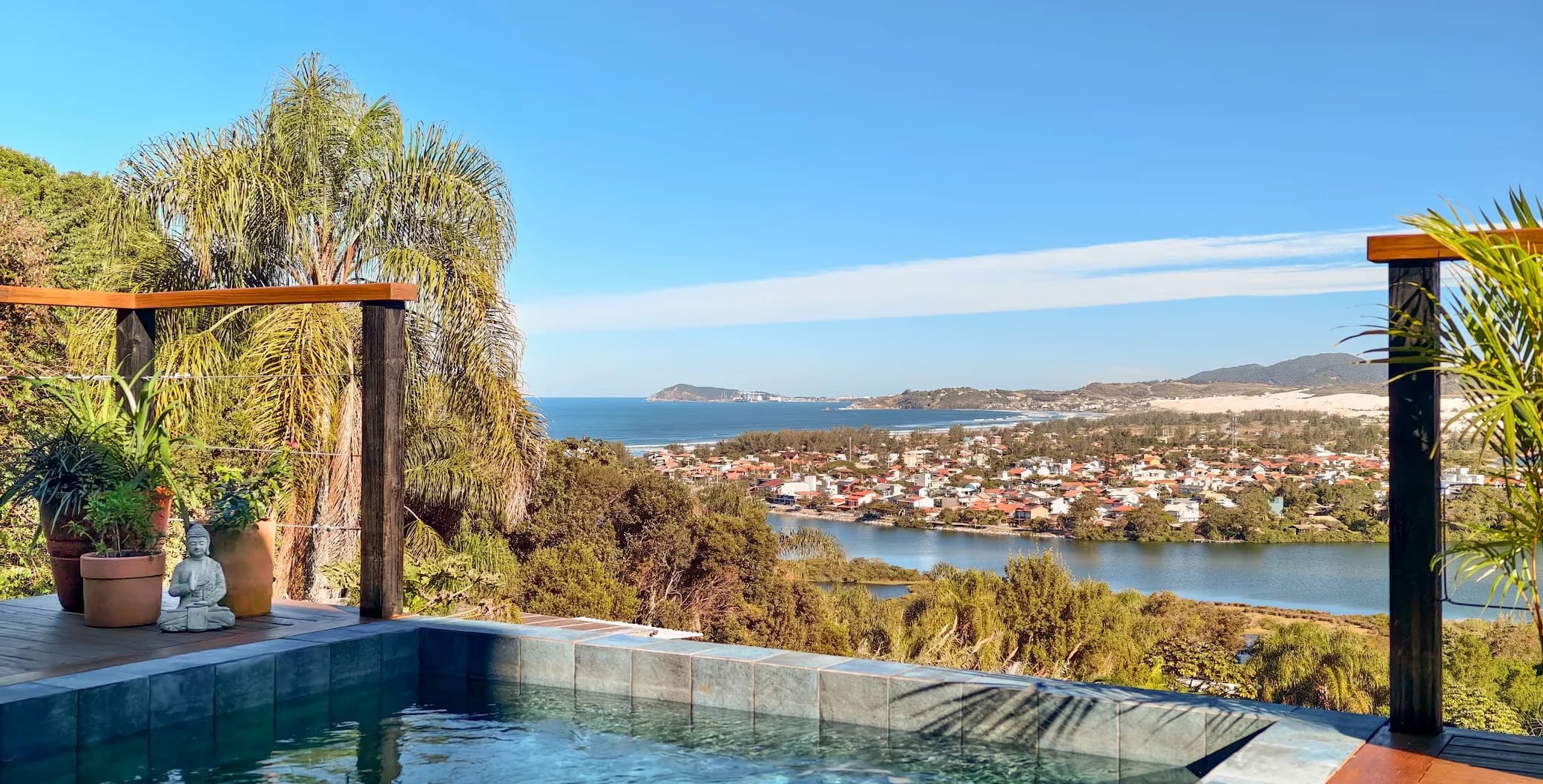 Heated pool at Casa Galeria overlooking the Ibiraquera lagoon and the open Atlantic beyond